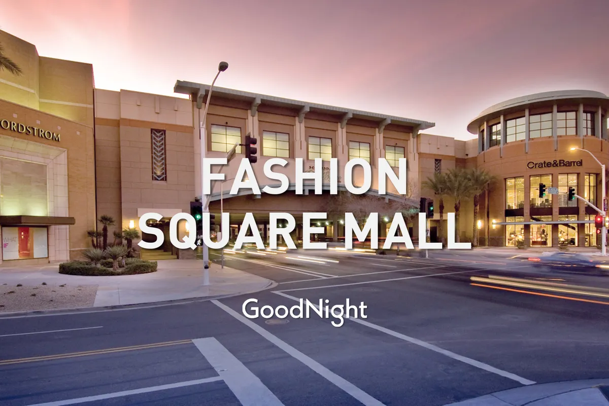 A lively streetscape featuring prominent storefronts like Nordstrom and Crate & Barrel, surrounded by palm trees and bustling with activity. The scene is vibrant, with people shopping, dining, and socializing in a dynamic urban environment.
